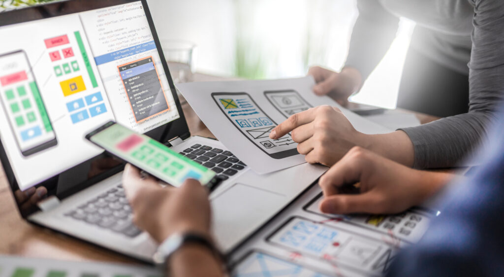 Designers drawing website ux app development.